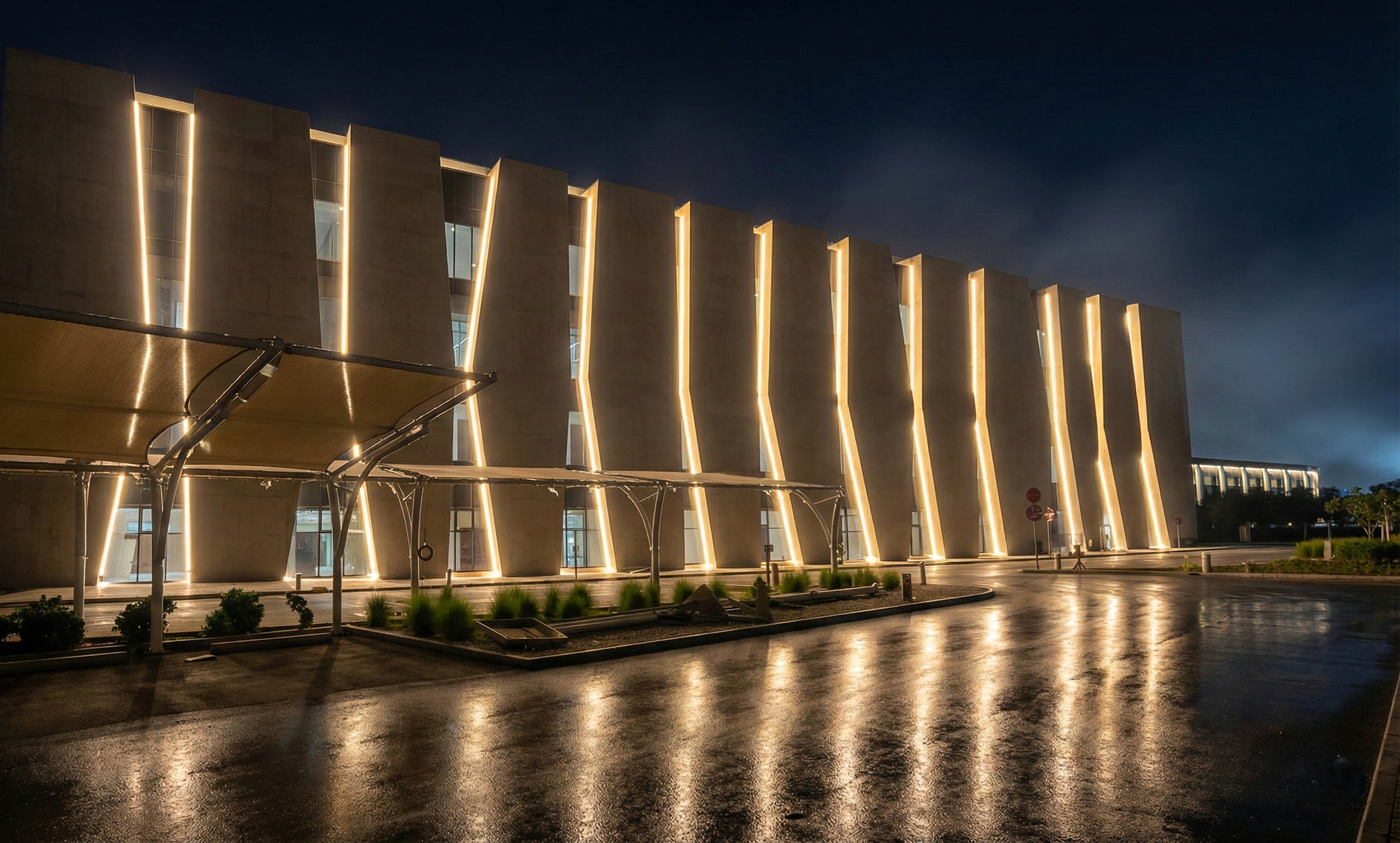 Completed institutional building illuminated at night